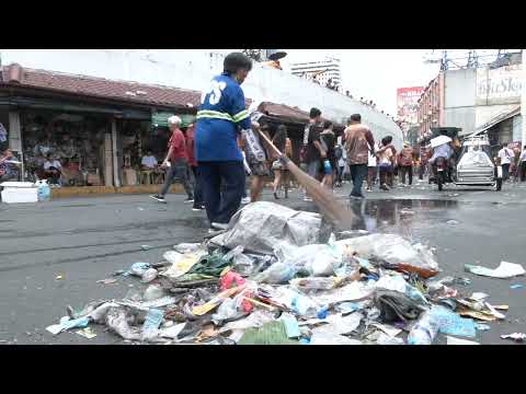 Workers clean up streets in Manila after image of Jesus Nazareno passed through