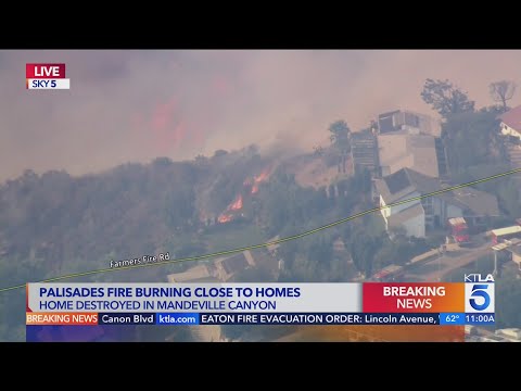 Massive flames approach Brentwood homes