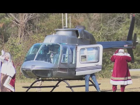 Santa Claus arrives by helicopter to spread Christmas joy to Jefferson County students