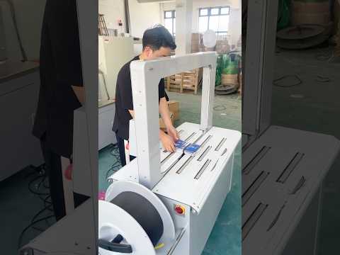 Automatic box strapping machine