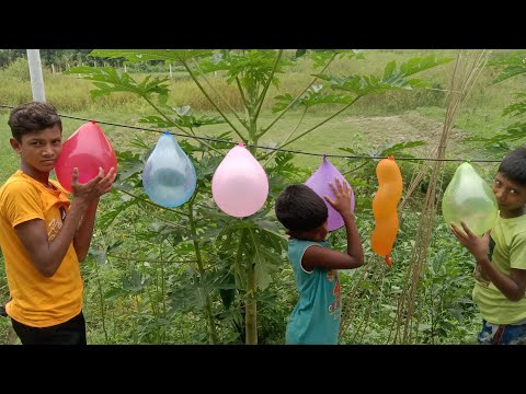 Smiling Kids: Balloon Blowing Excitement