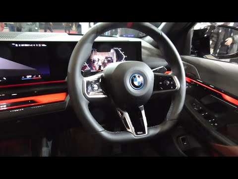 BMW i5 M60 xDrive 2023-2024 from the driver's seat to the back seat