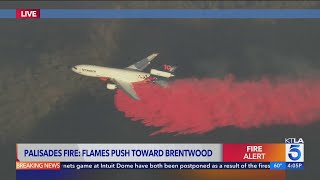 Palisades Fire pushes toward Brentwood, aerial crews work to save homes