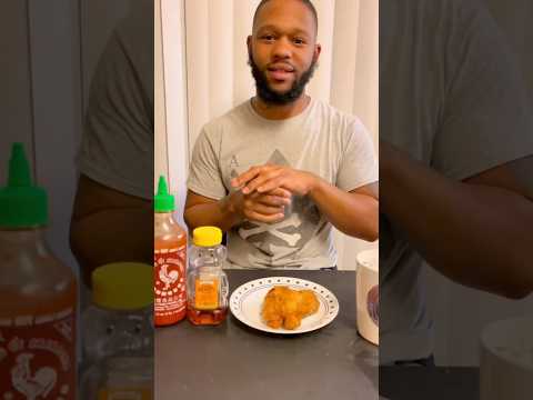 Someone on facebook asked him to try it and we’ll here he is #friedchicken #popeyes #sirracha #honey