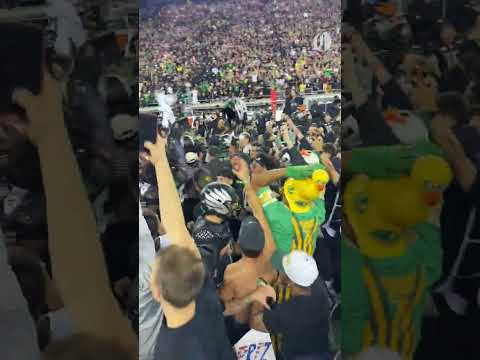 Oregon Duck fans rush the field after taking down Ohio State