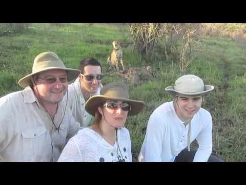 Patland family watching Cheetas eat their kill in South Africa