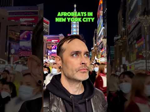 Afrobeat vibes in the heart of Times Square—bright lights, big beats, endless energy! 🗽🎶✨