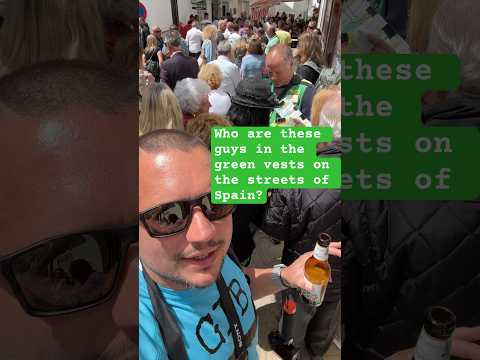 Guys in Green Vests in Streets of Spain YouTube Explanation