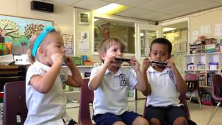 Montessori Children Playing The Harmonica