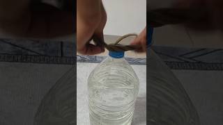 Making a handle to lift water bottles using a rope is a useful idea ##short#shortvideo