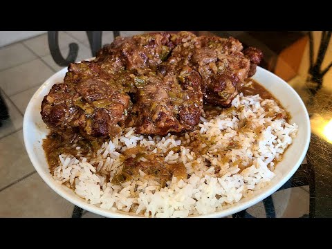 Oxtails Smothered in Gravy over rice.