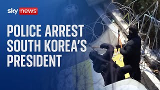 Police climb barricades to arrest South Korea's President Yoon Suk Yeol