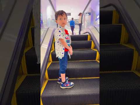 Funny cute baby sitting on #escalator and going home alone🏠😂