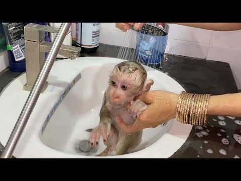 Mom take a bath for cute little baby boy