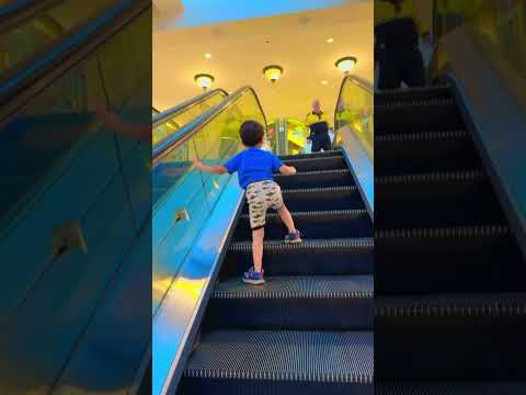 Sweet baby alone on the #escalator journey goes very bravely