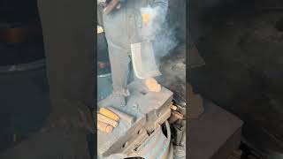 The process of craftsman blacksmith installing the knife handle