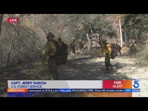 Fire crews from U.S. Forest Service clear brush in anticipation of increased fire activity