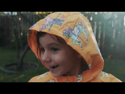 Having fun in kids' colour changing rainwear