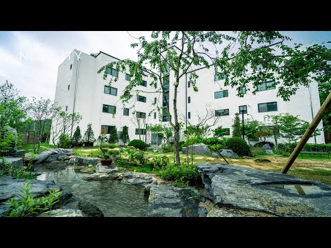 Modern duplex penthouse with waterfall and pond