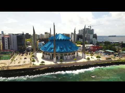 Maldives island aerial view bungalows luxury resort vacations 4K