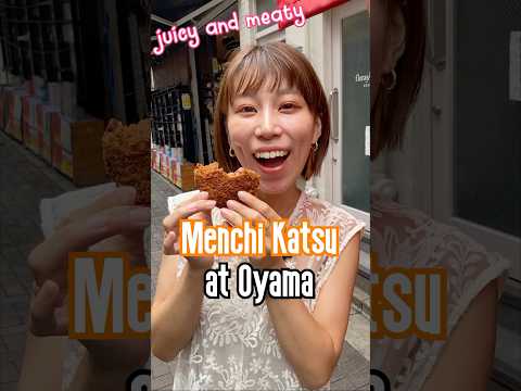 A Japanese girl shares Wagyu Beef Cutlet, Menchikatsu at Ohyama in Ueno Ameyoko Street