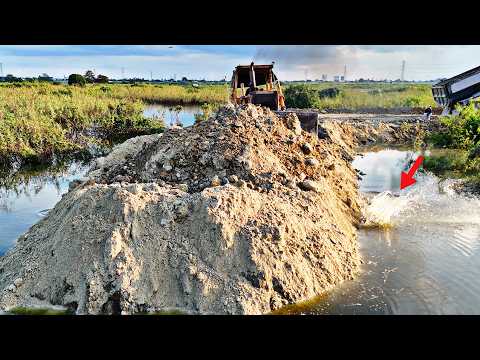 Most Specially Land Filling Operator Nearly Connecting To Other Size, Dozer Pushes Dirt Making Dike