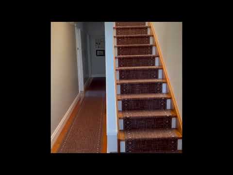 Laying carpet runner on the  stairs