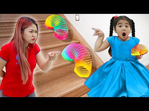 Suri Likes Playing with  Colorful Rainbow Slinky Toys