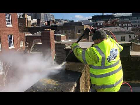 Doff steam cleaning Portland stone in the city of London