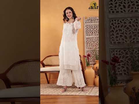 Exquisite white chikankari kurta and palazzo set, featuring intricate embroidery work.