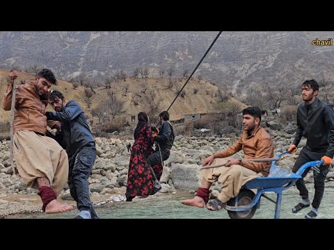 Chavil family crossing the river to take the injured patient to the hospital