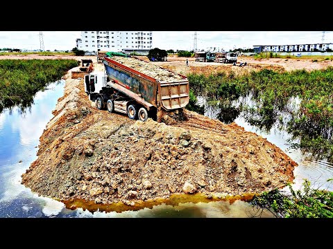 Especially Active Bulldozer Pushing Soil Crossing The Water Resort Building Komatsu D53P