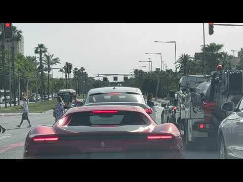 Driving in Barcelona with a Ferrari 296 GTB in front