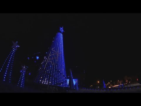 Cars in Conway line up in front of Christmas house light show