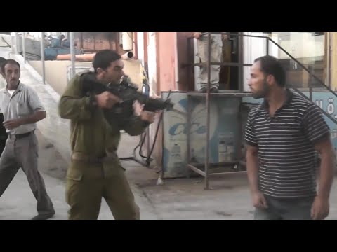 Israeli Soldiers and Palestinians Clash! American Gets Arrested! Soldier Hits man In Wheelchair!