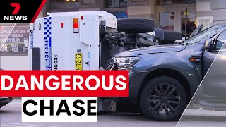 Police car rolls during wild pursuit through Newcastle | 7NEWS