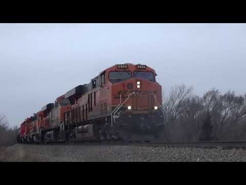 BNSF 6666 leads a  mixed freight w/7831, 2665, 1530 and DLCX 3138 in Greenwood, NE