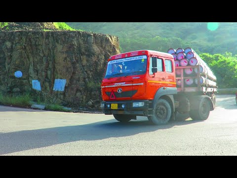 KHAMBATKI GHAT:3 SLOWELY GOING HEAVY LOADED TRUCKS AT HAIR PIN BEND ROAD