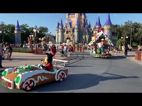 Goofy and Max and Clarabelle in the Christmas Parade at Magic Kingdom at Walt Disney World