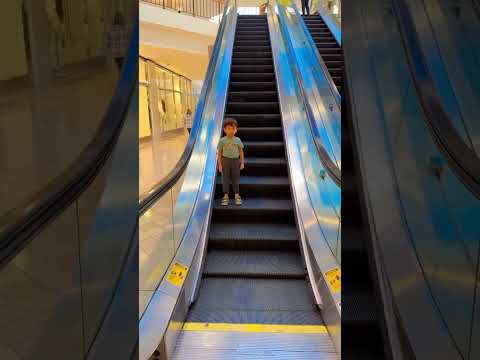 Cute 😍kiddo gliding down the #escalator alone🤩🥳😎