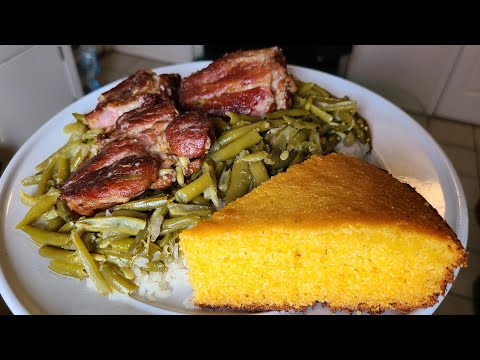 French Style Green beans and neck bones over rice with cast-iron skillet cornbread