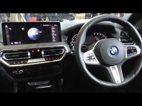 BMW iX3 M Sport 2023-2024 from the driver's seat to the back seat