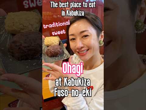 A Japanese lady shares traditional Japanese sweets, Ohagi in Kabukiza, Ginza