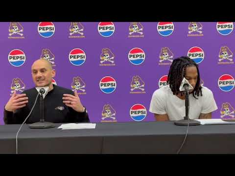 ECU Basketball Coach Mike Schwartz and Guard Jayshayne Woodard after home win against Temple