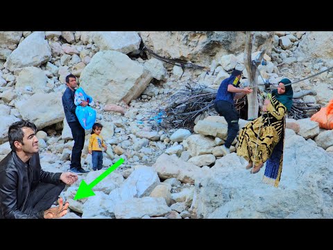 Chavil family crossing the river and Ali's hands were wounded