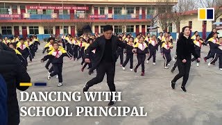 Chinese school principal teaches students shuffle dance during break