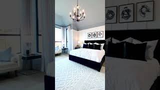 Owners Suite Bedroom Design with Blue Vaulted Ceiling and Wall Molding - Model Home Tour