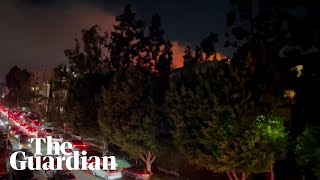 Chaotic scenes in Los Angeles as Hollywood Hills fire triggers evacuation