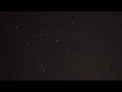 Lowlight Camera Captures 15 Starlink Satellites passing by Comet Atlas all in a row. HD Video