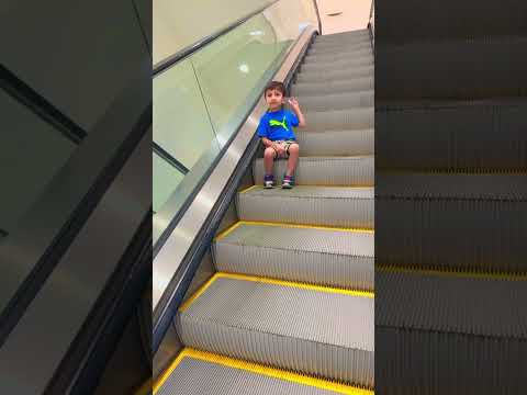 Precious cute kid on an #escalator without help😜😂😍